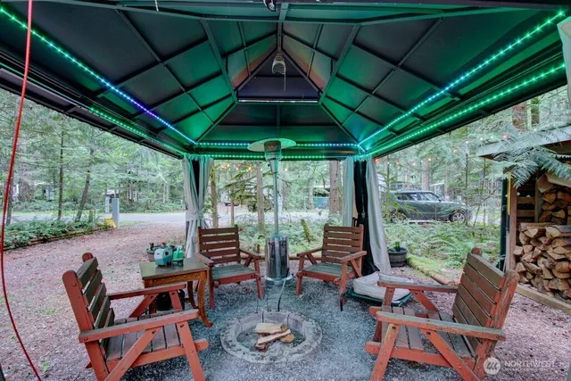 a backyard of a house with outdoor seating