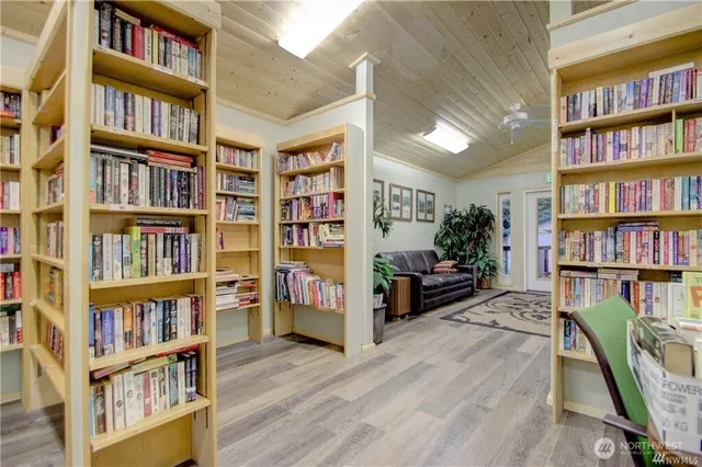 a view of living room with furniture and book shelf
