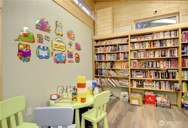 a reading room with toys and book shelf