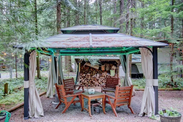 a view of wooden table and chairs in patio