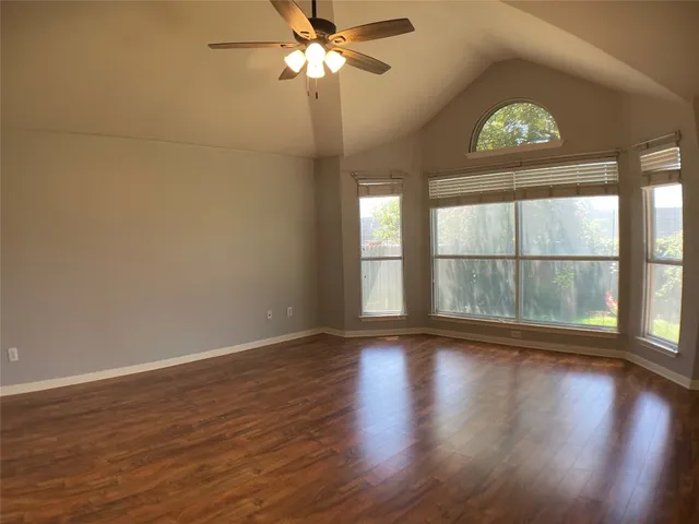 a kitchen with stainless steel appliances granite countertop a stove refrigerator and a microwave