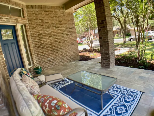 a view of a backyard with sitting area