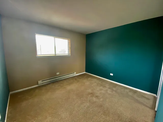 an empty room with a empty space and window