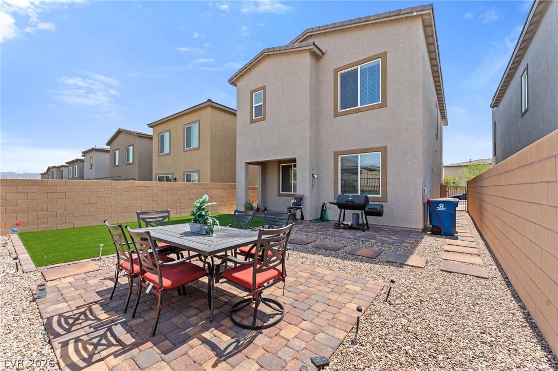 8879 Roadrunner Ravine Street Las Vegas, NV 89166 - Photo 37 of 39 A private backyard oasis awaits with a paver patio perfect for outdoor entertaining.