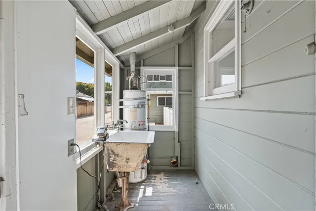 a kitchen with cabinets appliances and a sink