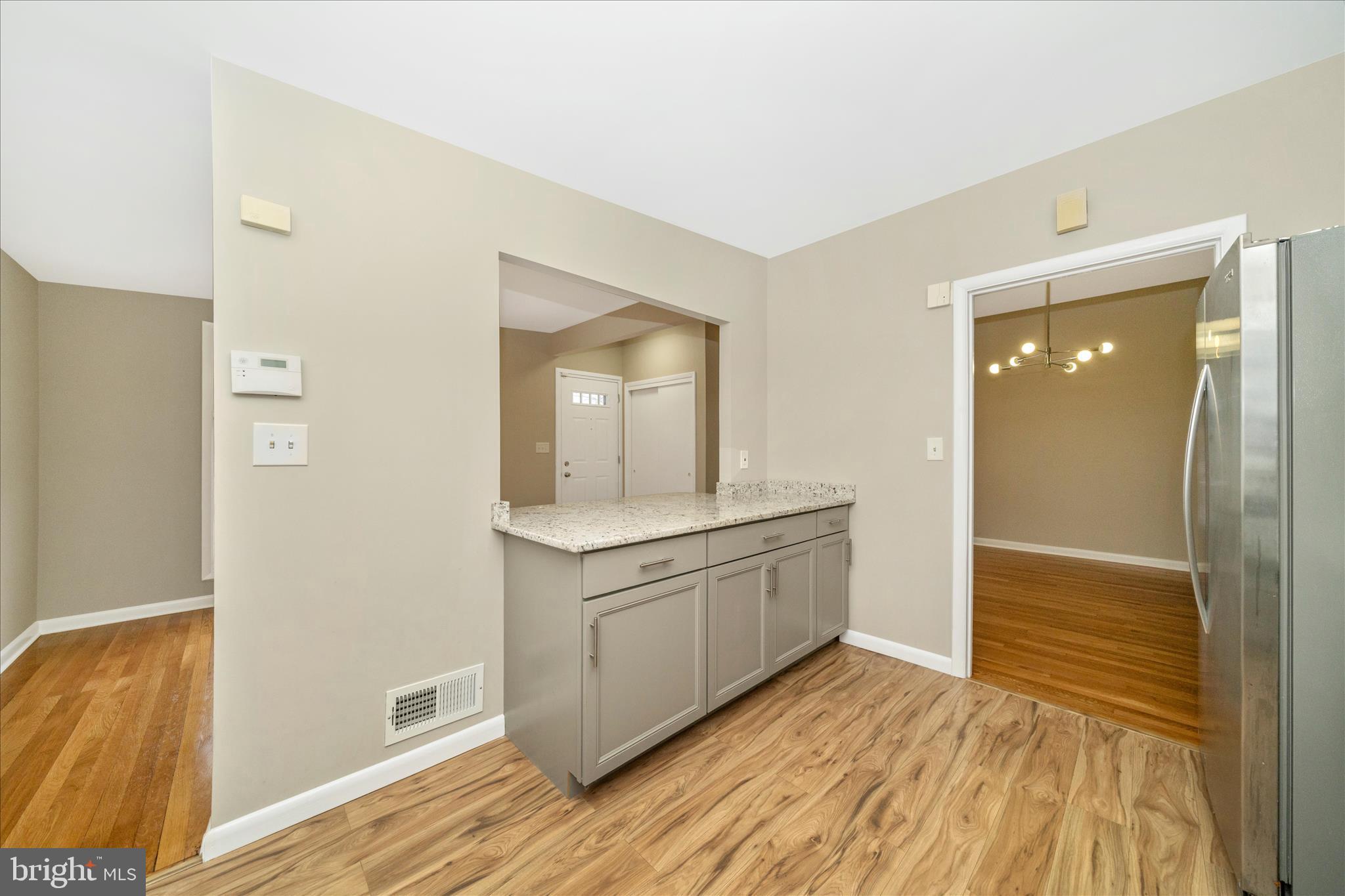 1302 Glenmont Road Baltimore, MD 21239 - Photo 19 of 49 a bathroom with a sink and a mirror
