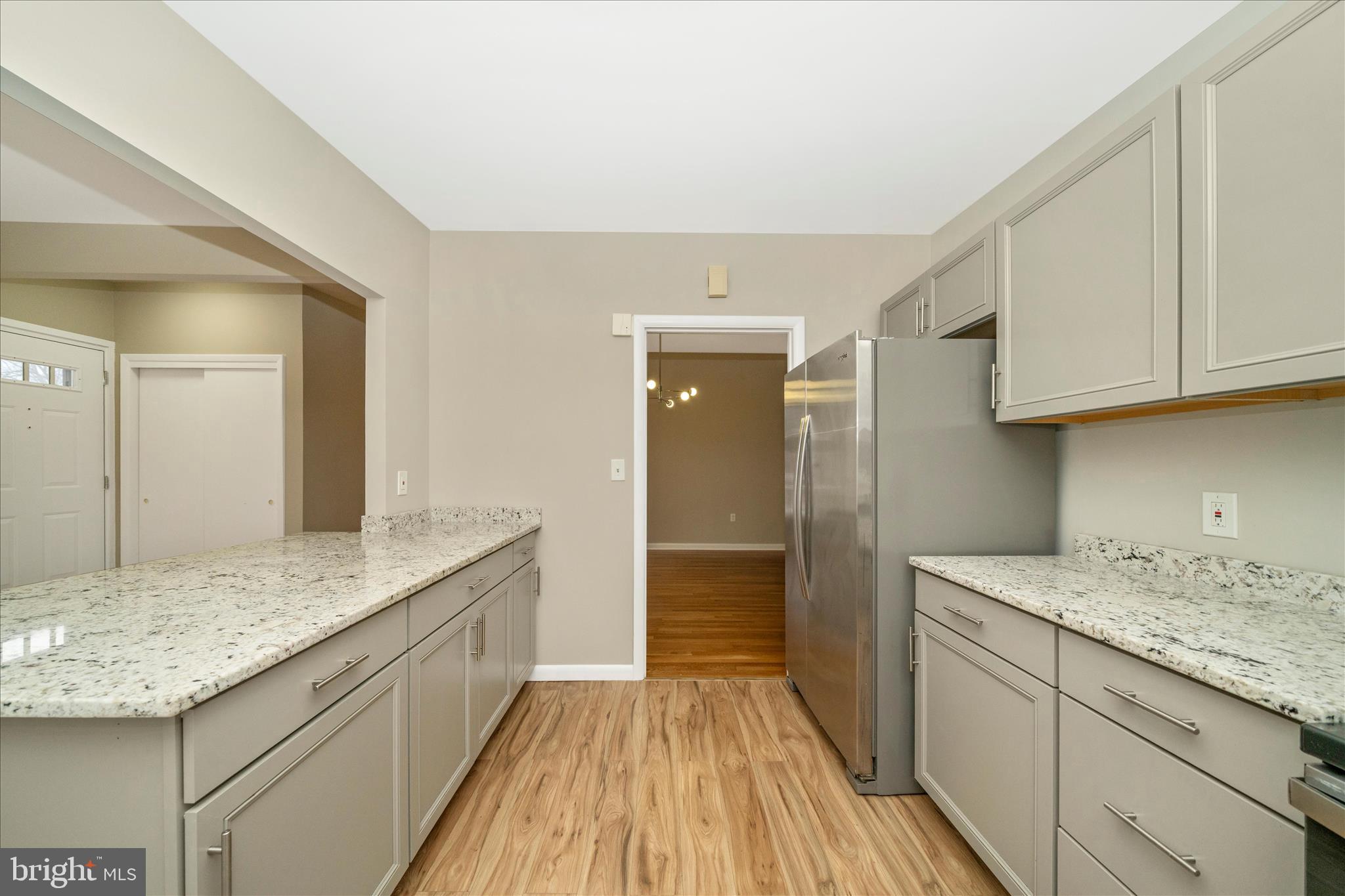 1302 Glenmont Road Baltimore, MD 21239 - Photo 20 of 49 a bathroom with a granite countertop sink and a mirror