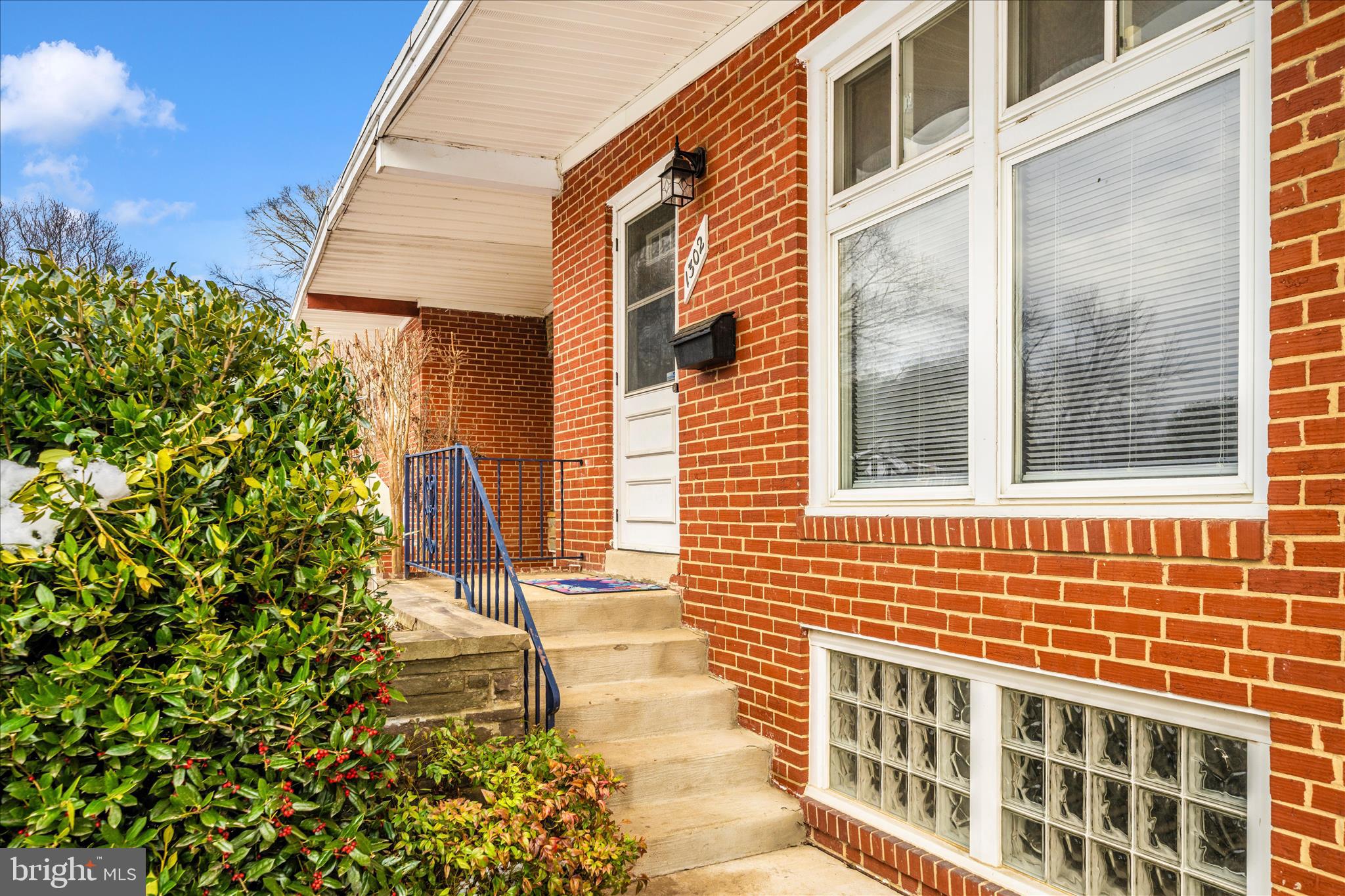 1302 Glenmont Road Baltimore, MD 21239 - Photo 3 of 49 a view of a brick buildings with many windows