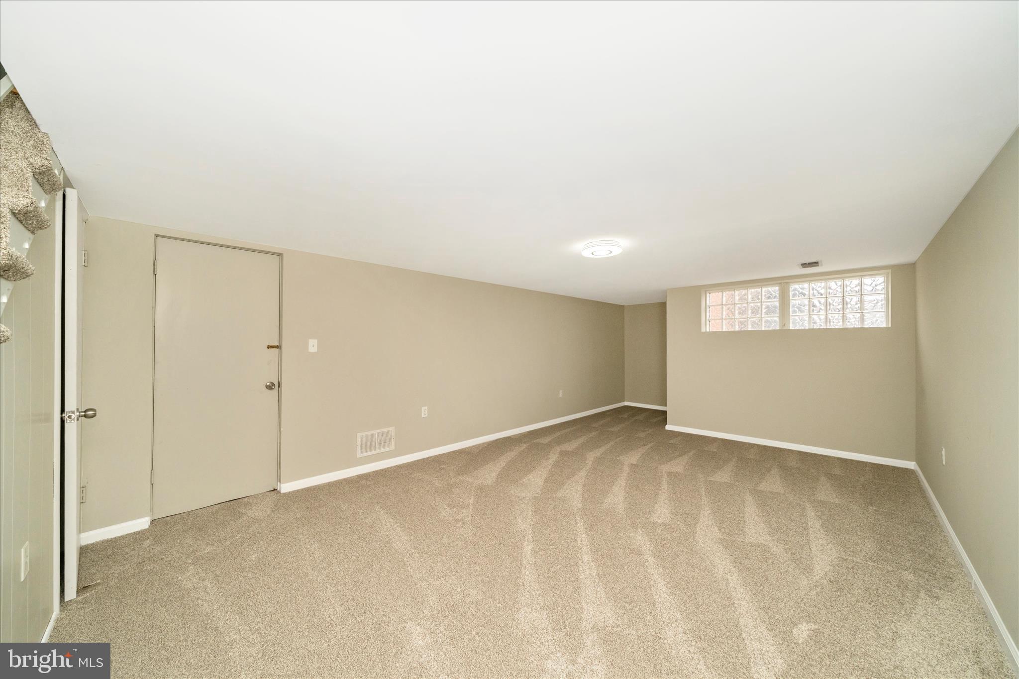 1302 Glenmont Road Baltimore, MD 21239 - Photo 34 of 49 a view of an empty room and window