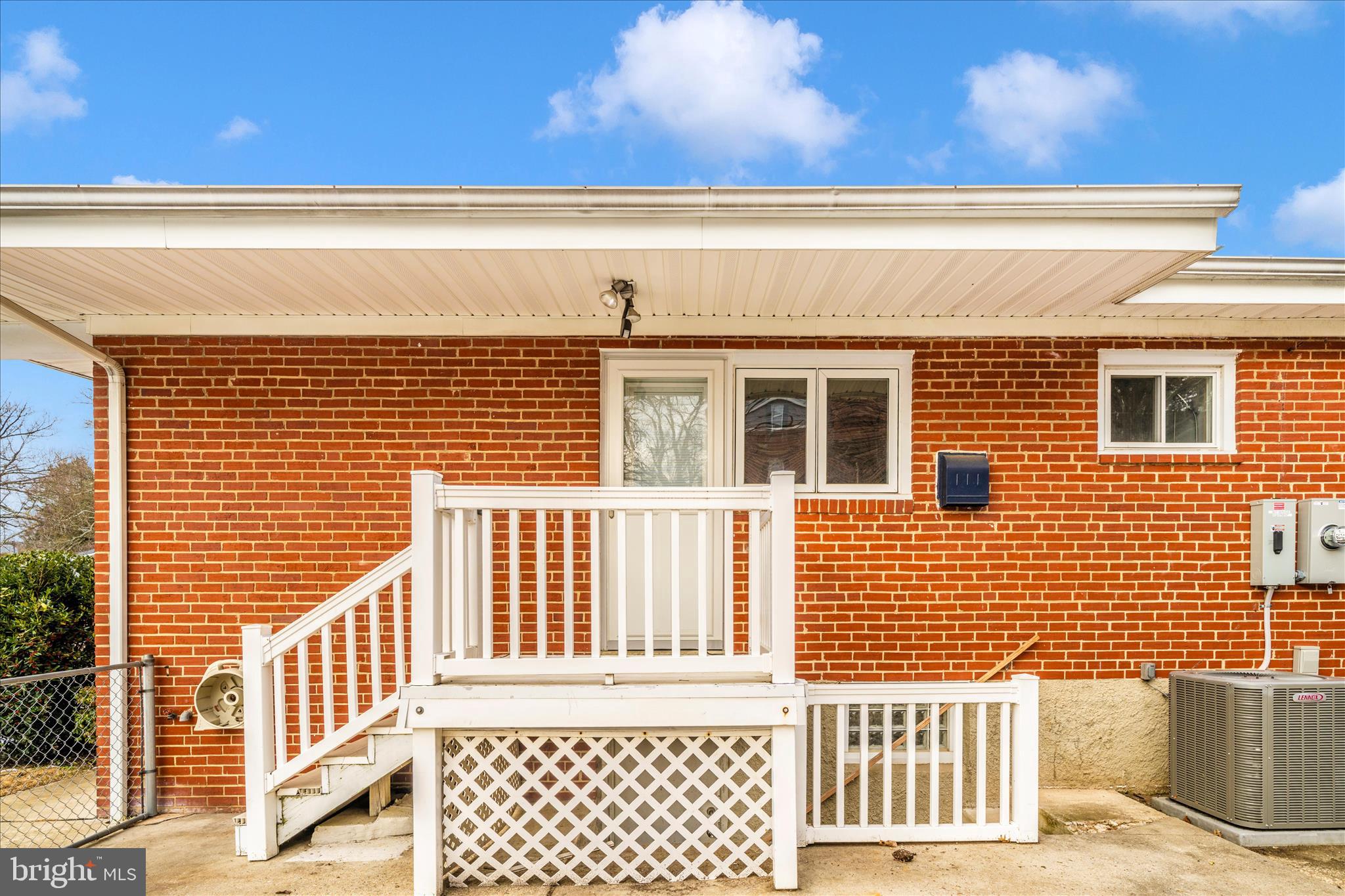 1302 Glenmont Road Baltimore, MD 21239 - Photo 40 of 49 a view of a brick wall with a large window