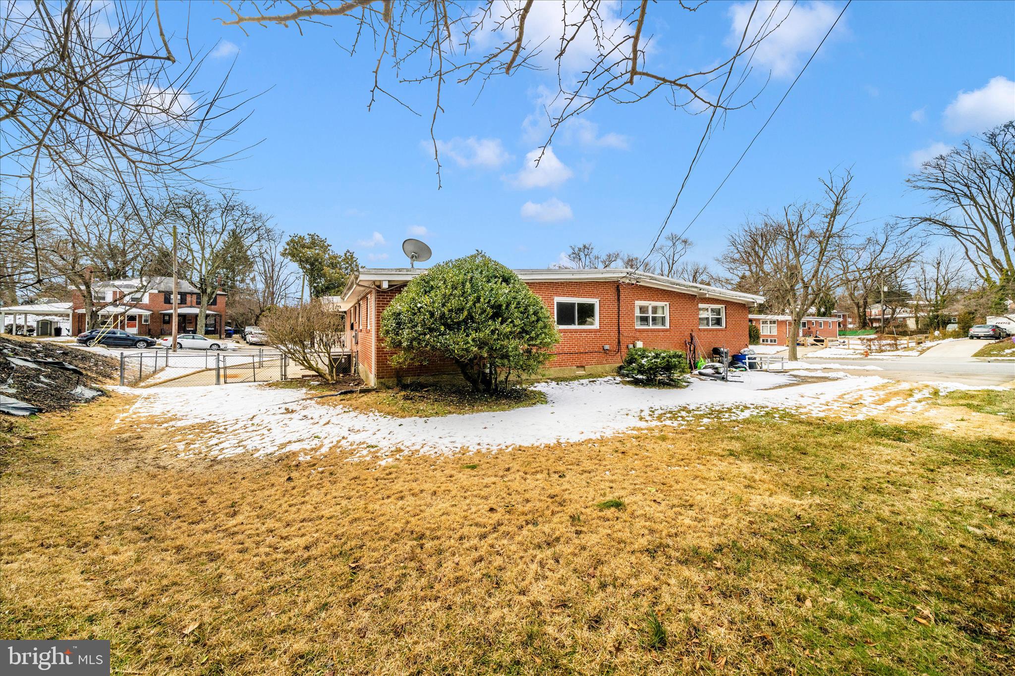 1302 Glenmont Road Baltimore, MD 21239 - Photo 42 of 49 a front view of a building with a yard