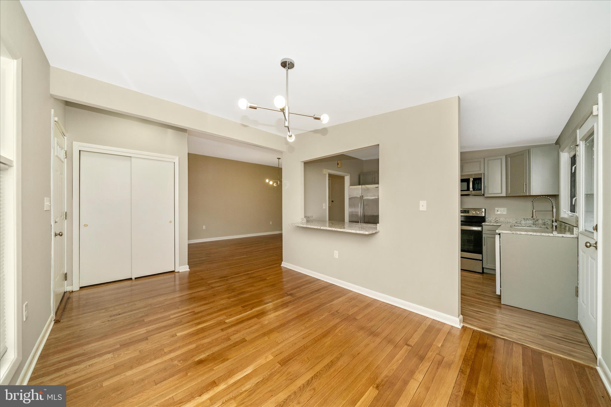 1302 Glenmont Road Baltimore, MD 21239 - Photo 7 of 49 a view of a kitchen with a sink and a refrigerator