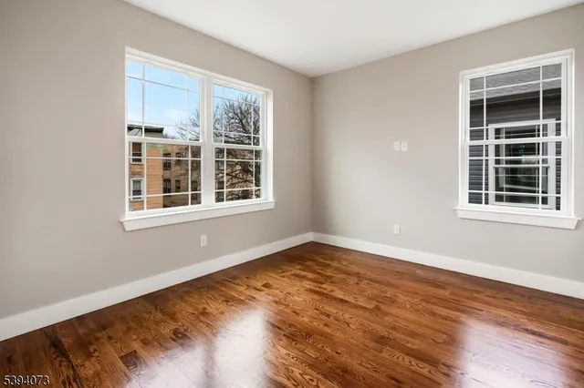 a view of empty room with windows