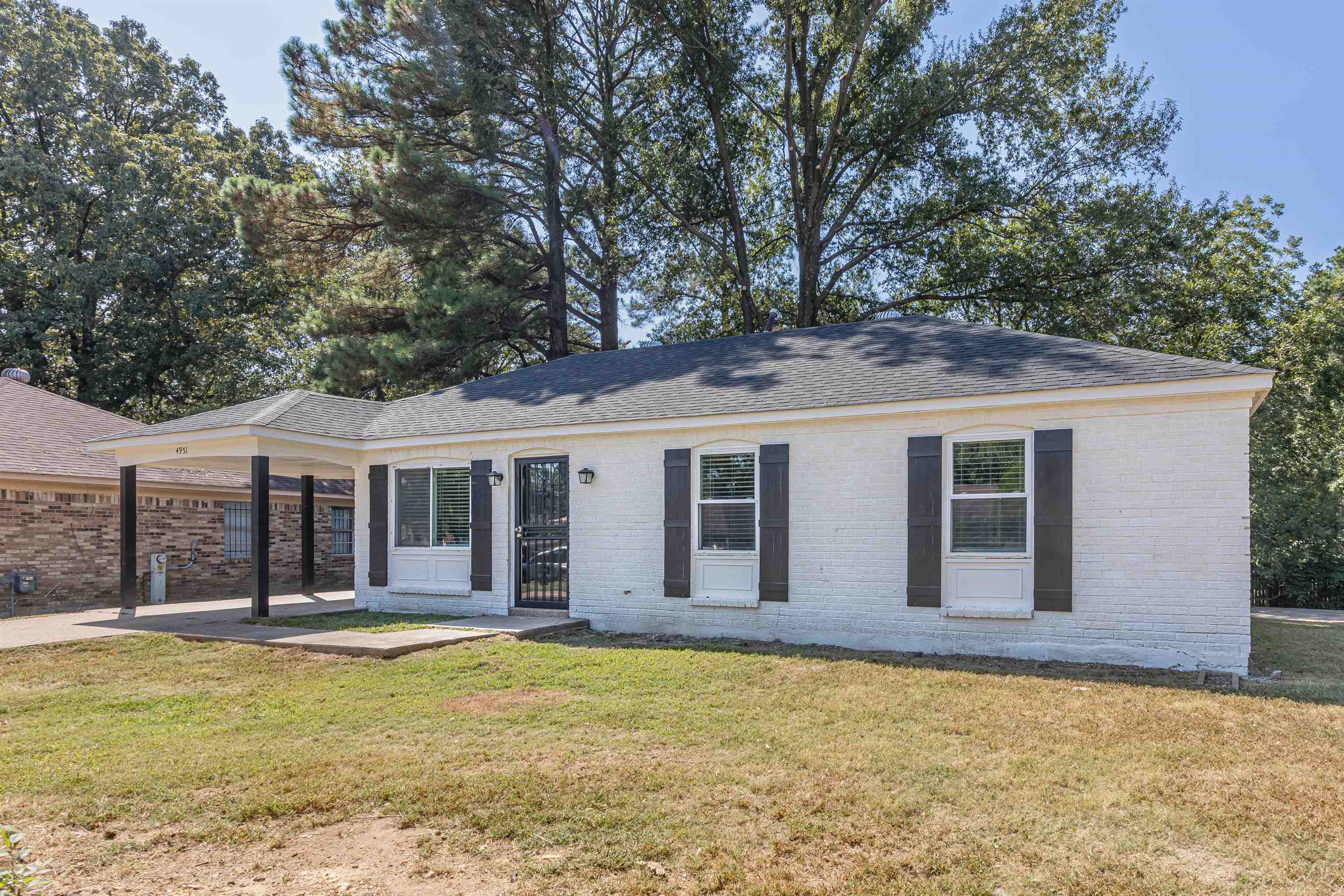 4951 Rosefield Road Memphis, TN 38118 - Photo 11 of 20 a view of a house with a swimming pool and porch