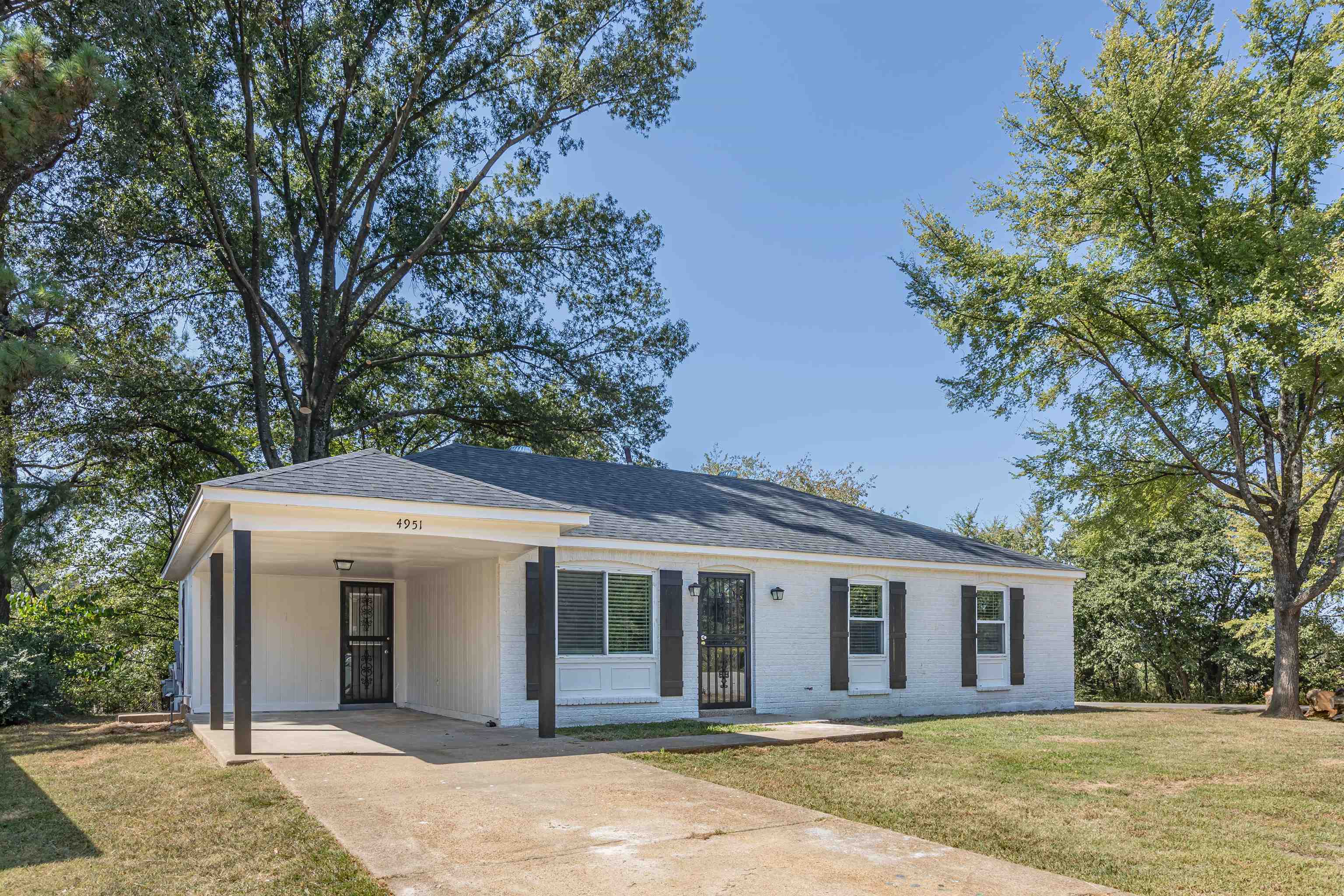 4951 Rosefield Road Memphis, TN 38118 - Photo 2 of 20 a view of a house with a backyard and large tree