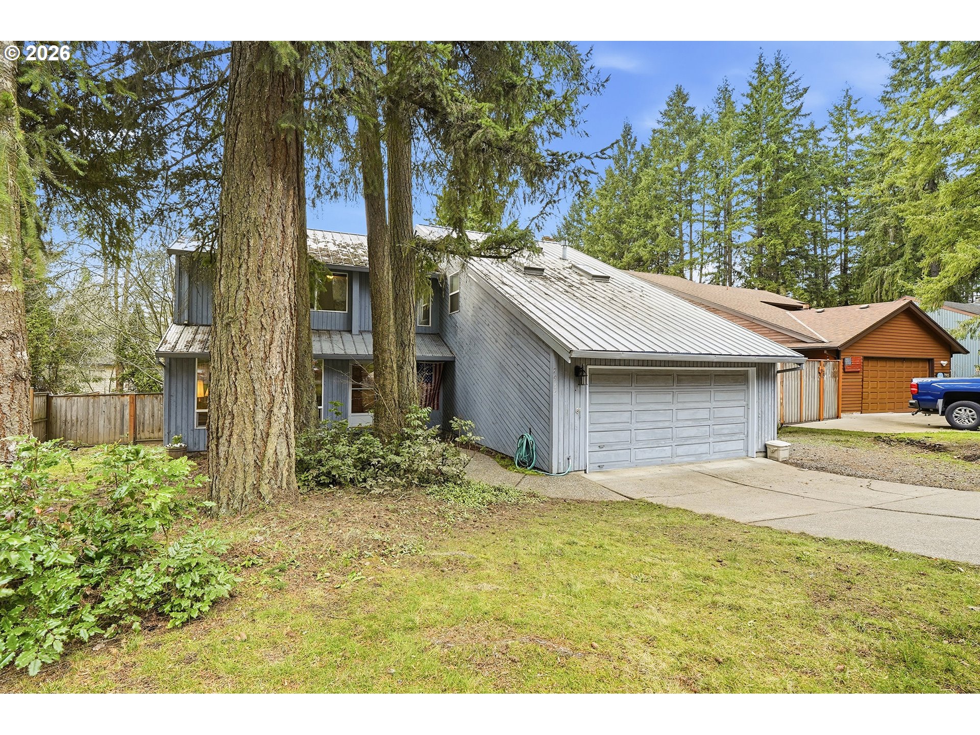 7935 Southwest Carol Glen Place Beaverton, OR 97007 - Photo 1 of 38 a view of a house with a yard and potted plants