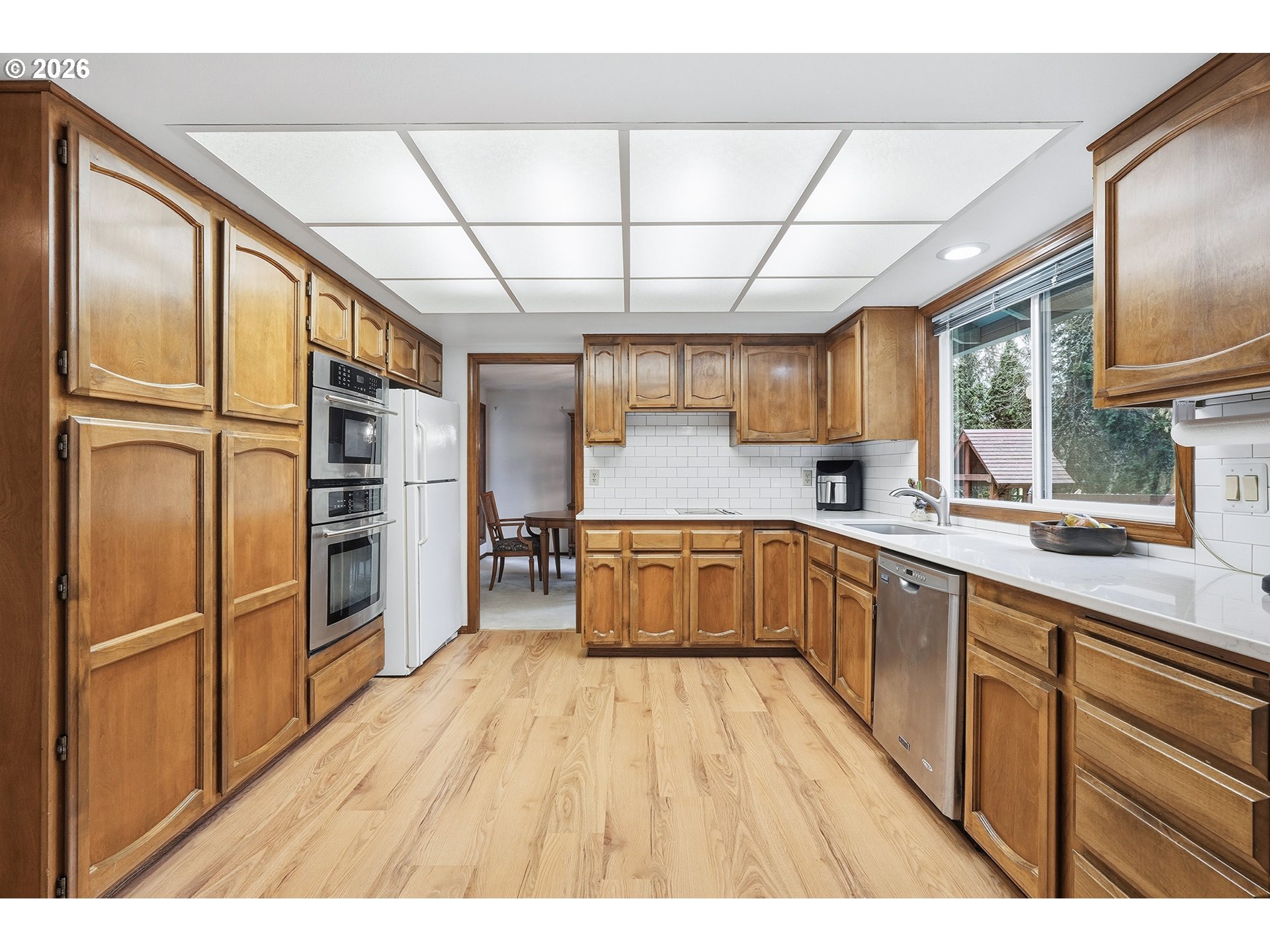7935 Southwest Carol Glen Place Beaverton, OR 97007 - Photo 11 of 38 a kitchen with stainless steel appliances a refrigerator and a sink
