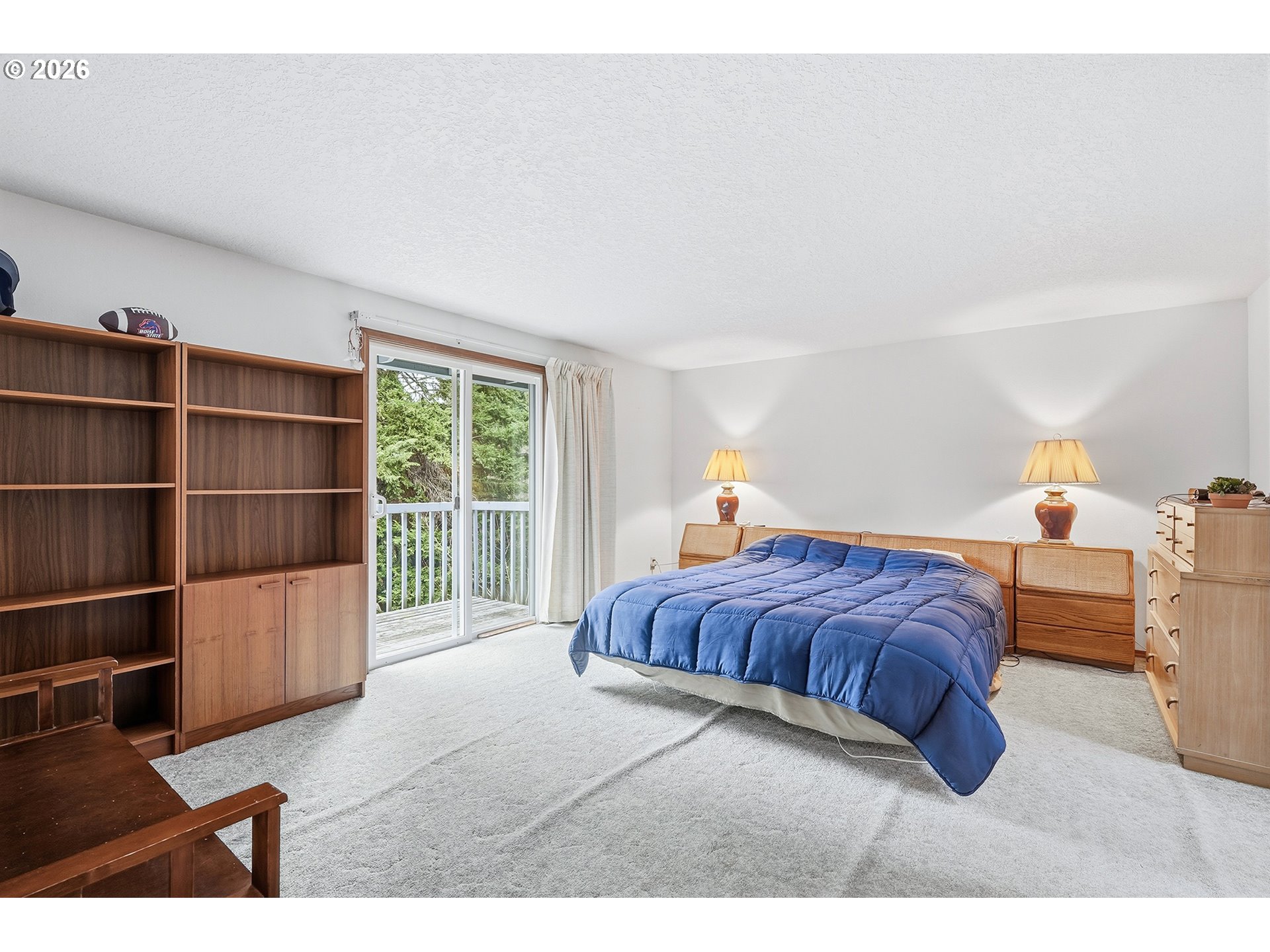 7935 Southwest Carol Glen Place Beaverton, OR 97007 - Photo 24 of 38 a bedroom with a bed a window and walk in closet