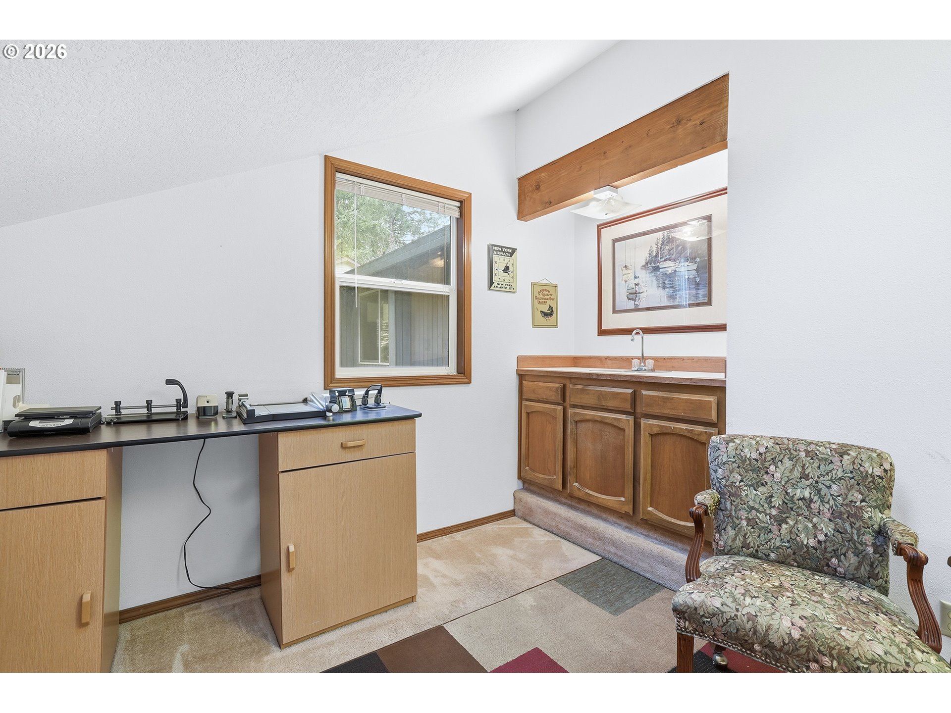 7935 Southwest Carol Glen Place Beaverton, OR 97007 - Photo 33 of 38 a kitchen with stainless steel appliances granite countertop a stove a sink and a microwave
