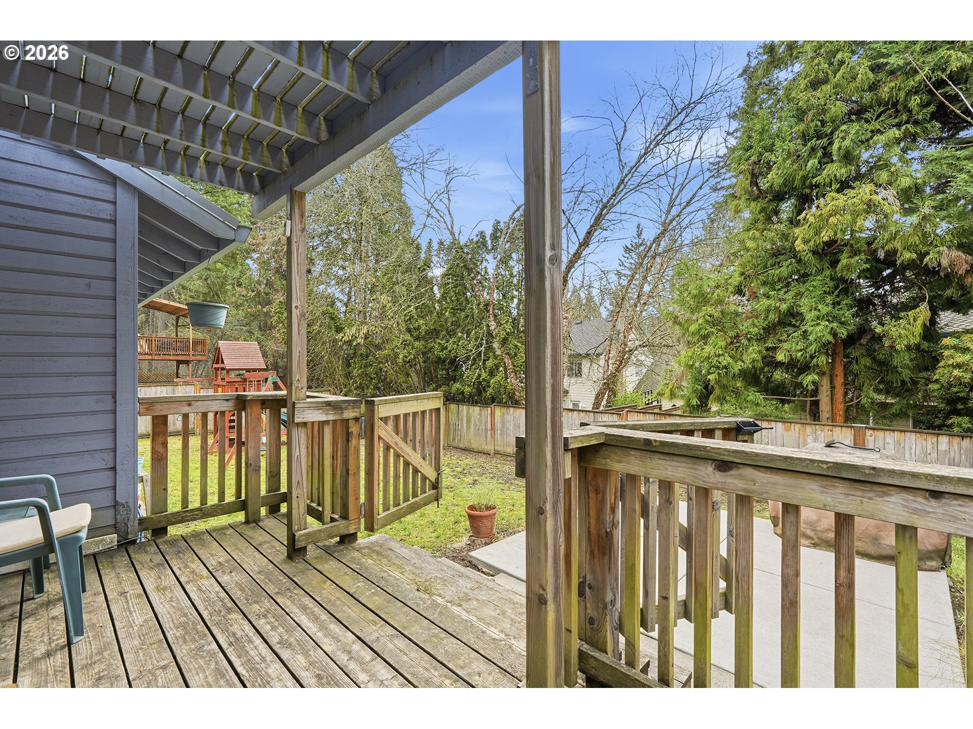 7935 Southwest Carol Glen Place Beaverton, OR 97007 - Photo 34 of 38 a view of balcony with wooden floor and outdoor seating