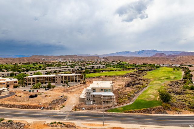 271 North Country Lane, Unit 60 St. George, UT 84770 - Photo 13 of 17 Aerial view of a mountainous background and a golf course