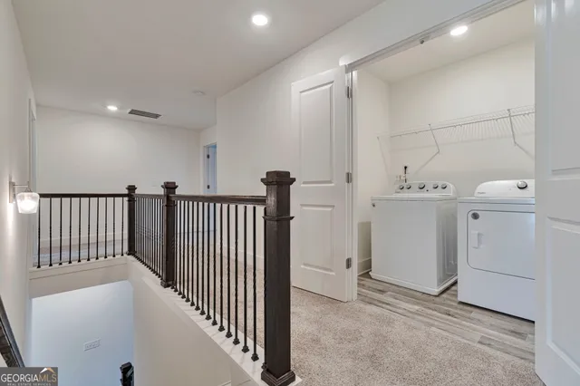 an empty room with a ceiling fan and a window