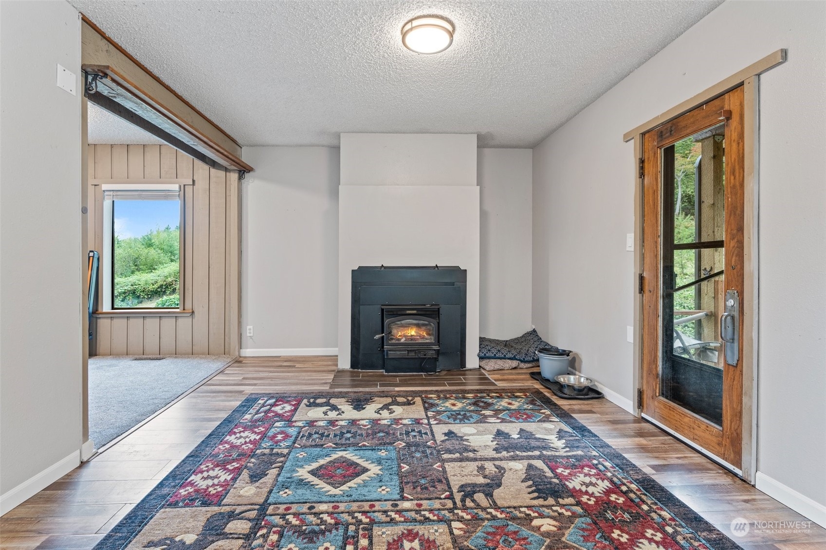 299 Logan Hill Road Chehalis, WA 98532 - Photo 11 of 40 a view of an empty room window and a fireplace