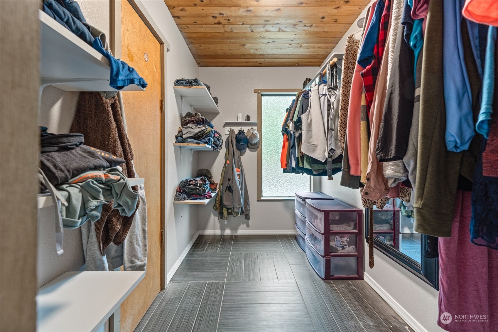 299 Logan Hill Road Chehalis, WA 98532 - Photo 18 of 40 a view of walk in closet with clothes and shoes