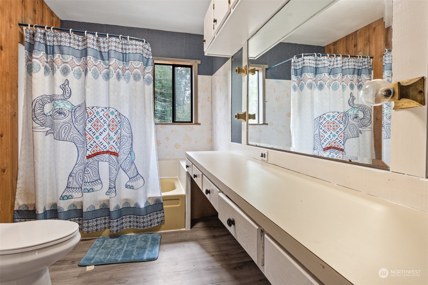 299 Logan Hill Road Chehalis, WA 98532 - Photo 24 of 40 a bathroom with a sink a toilet and shower curtain