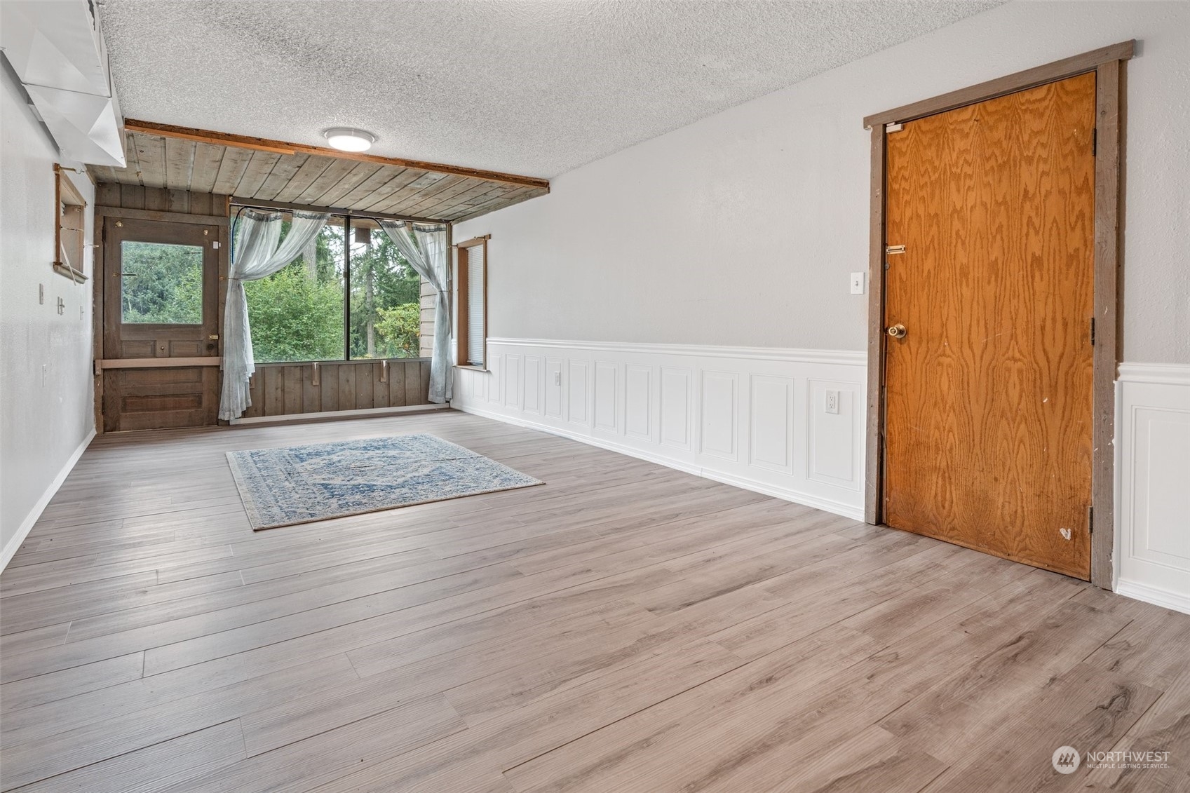 299 Logan Hill Road Chehalis, WA 98532 - Photo 27 of 40 an empty room with wooden floor and windows