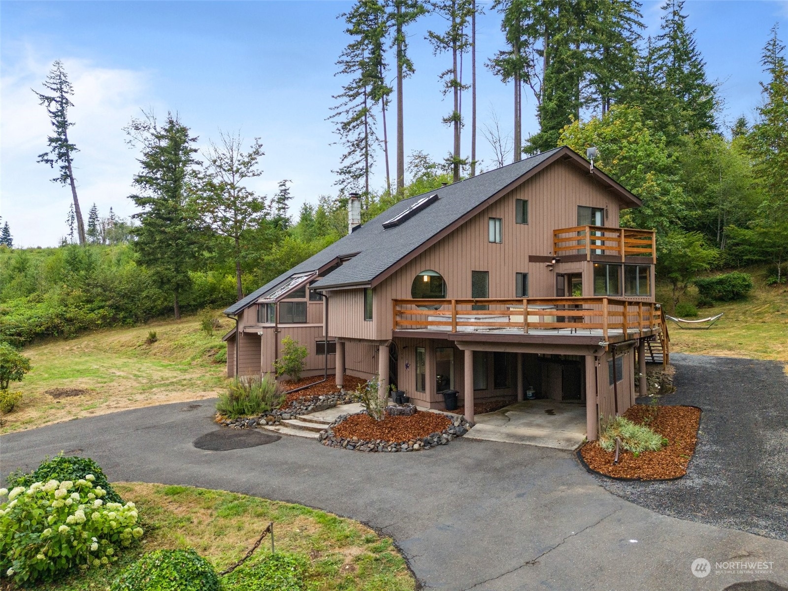 299 Logan Hill Road Chehalis, WA 98532 - Photo 3 of 40 a view of house with backyard and outdoor seating
