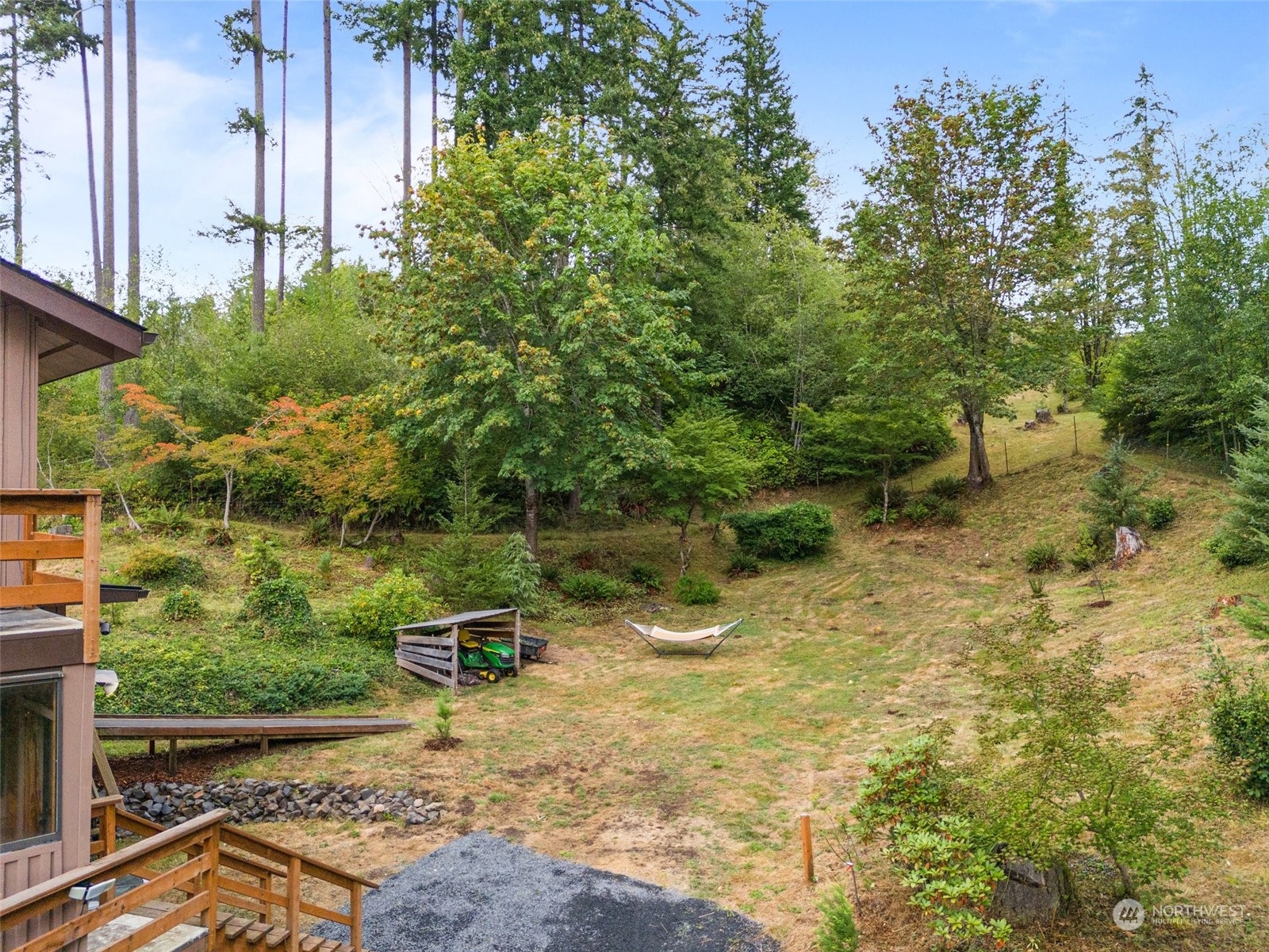 299 Logan Hill Road Chehalis, WA 98532 - Photo 33 of 40 a view of a lake with a bench and trees around