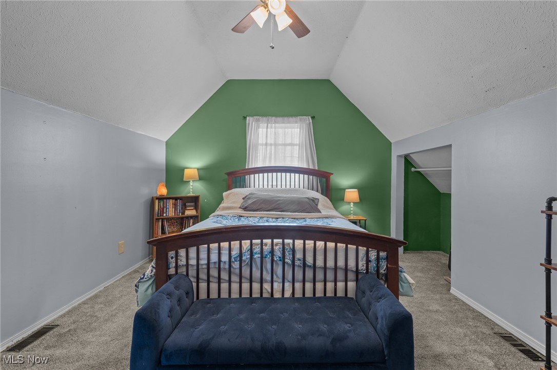 10641 Gilbert Road Newton Falls, OH 44444 - Photo 32 of 46 Carpeted bedroom with a textured ceiling, ceiling fan, and lofted ceiling