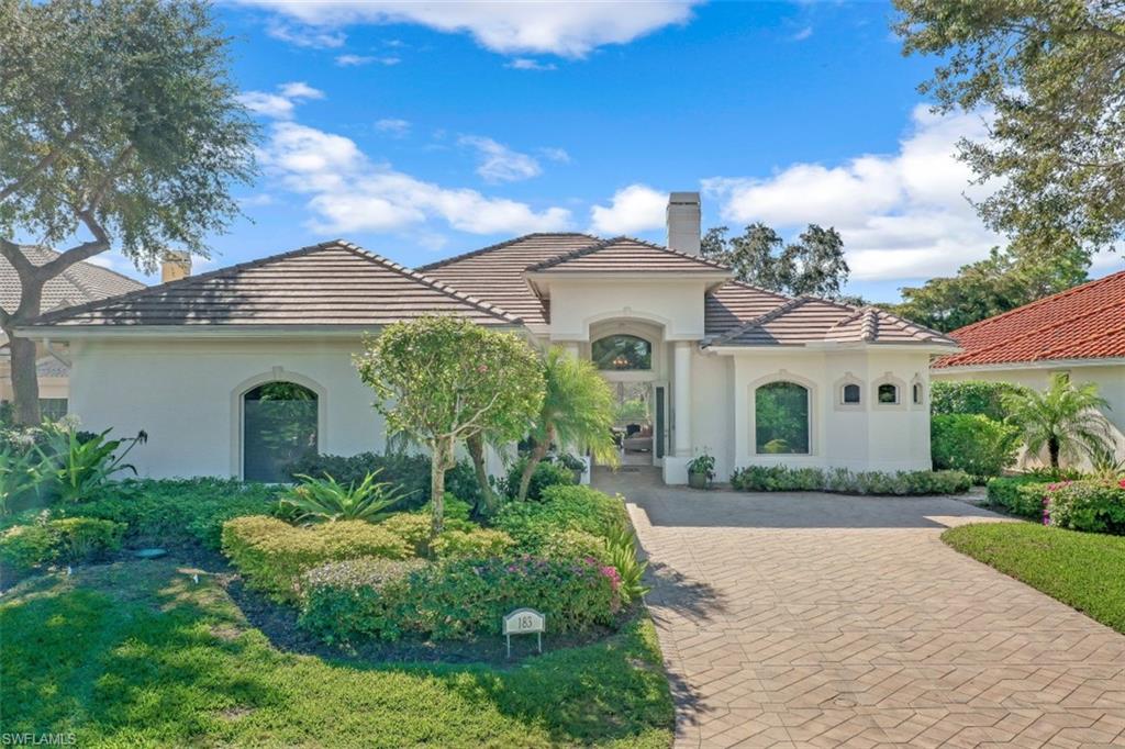 front view of a house with a garden