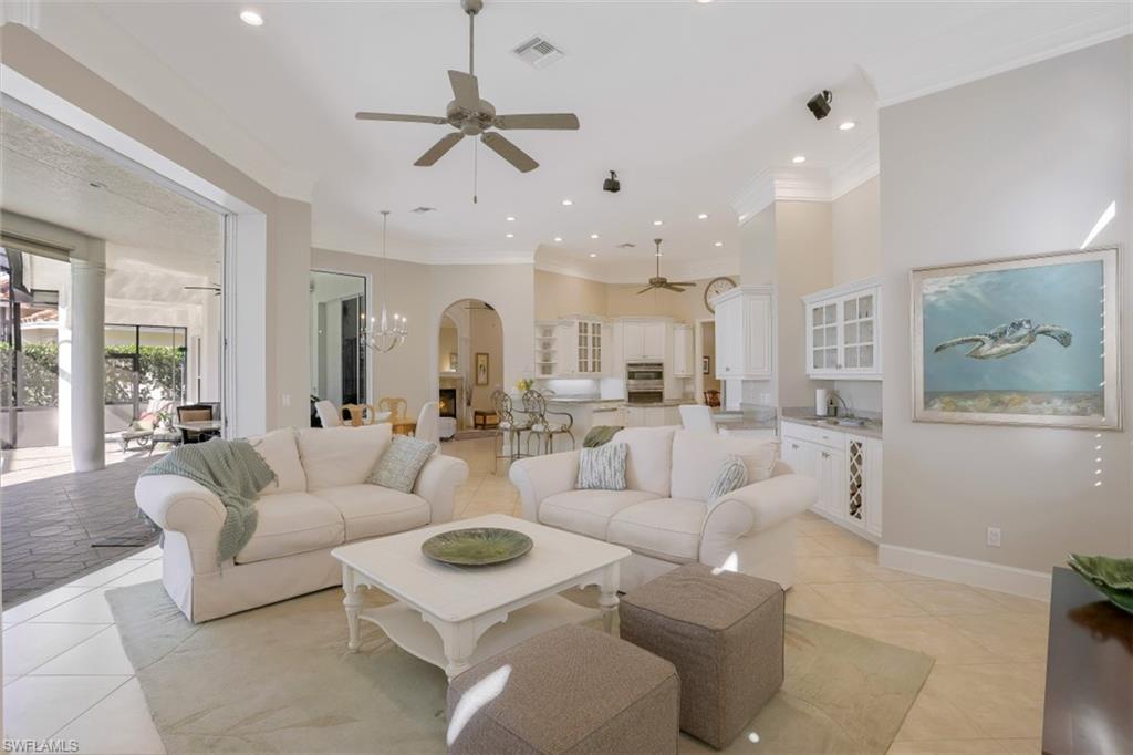 183 Audubon Boulevard Naples, FL 34110 - Photo 16 of 35 a living room with furniture kitchen view and a large window