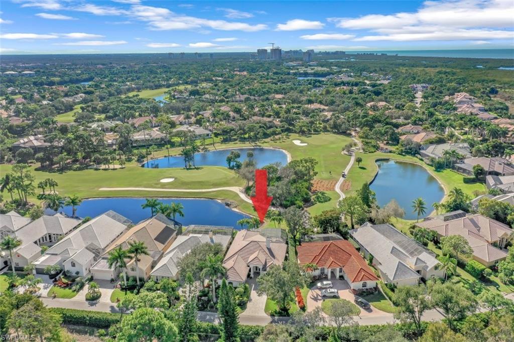 183 Audubon Boulevard Naples, FL 34110 - Photo 27 of 35 an aerial view of residential houses with outdoor space and lake view