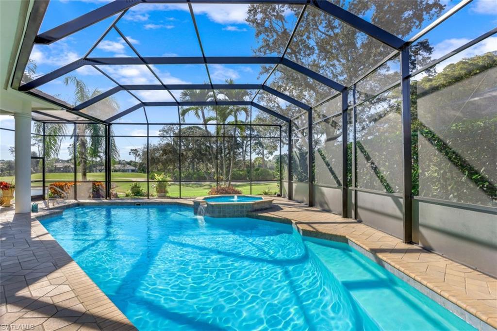183 Audubon Boulevard Naples, FL 34110 - Photo 3 of 35 a view of swimming pool with a patio