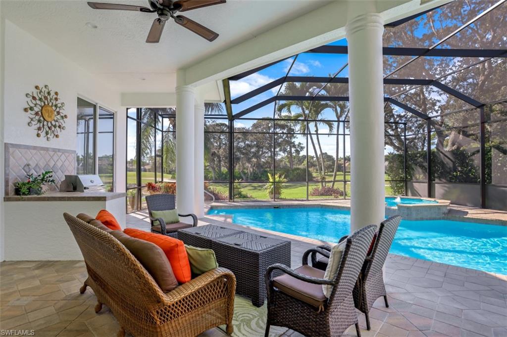 183 Audubon Boulevard Naples, FL 34110 - Photo 7 of 35 a dining room with furniture and a floor to ceiling window