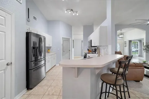 a kitchen with a sink cabinets and stainless steel appliances