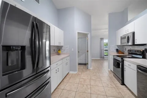 a bedroom with a bed and a television