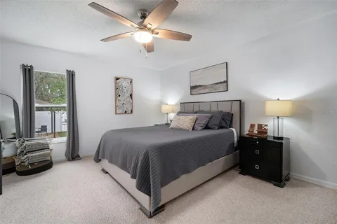 a spacious bathroom with a double vanity sink a mirror and a bathtub