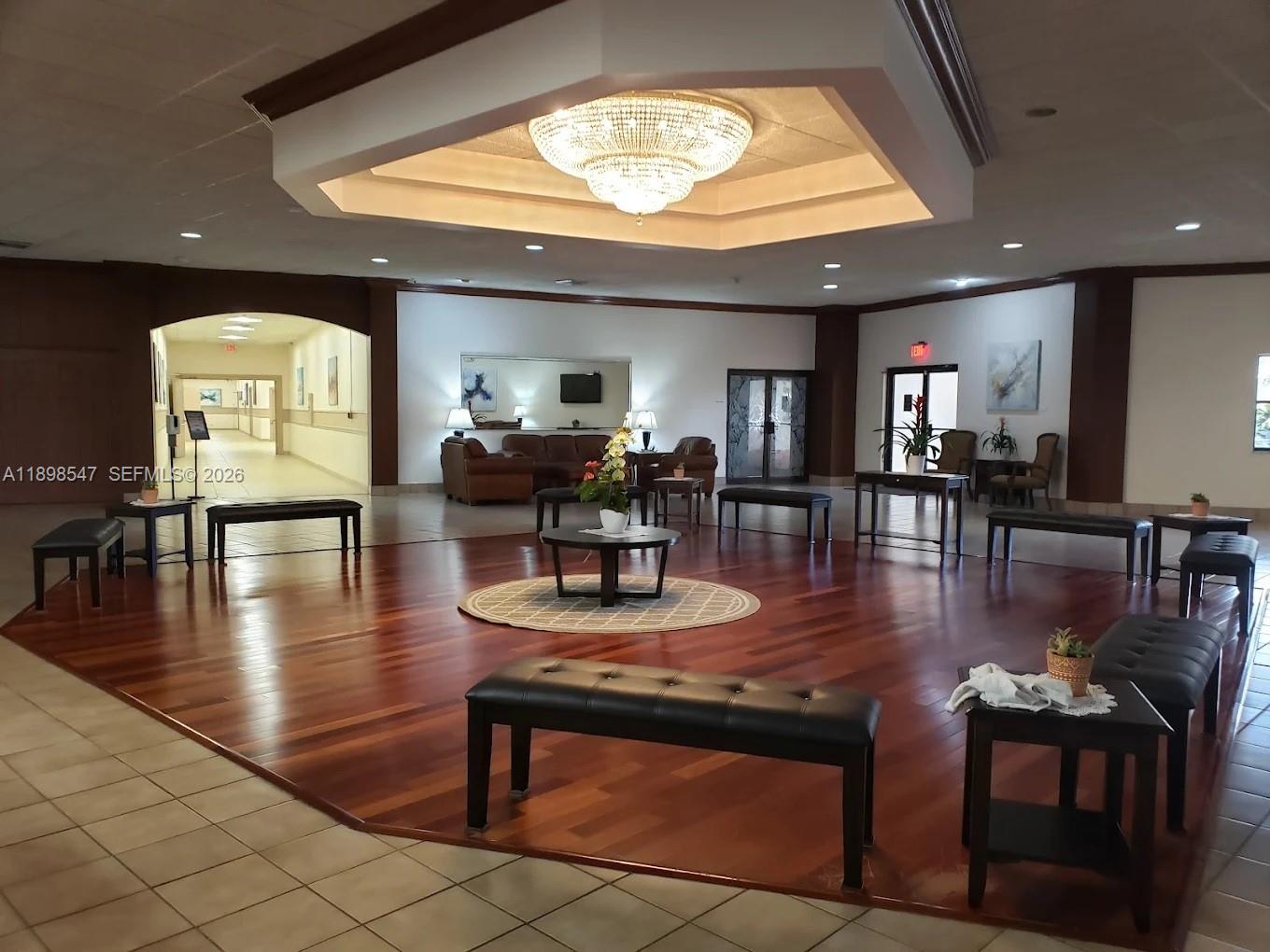 16200 Golf Club Road, Unit 312 Weston, FL 33326 - Photo 27 of 31 a view of a dining room with furniture