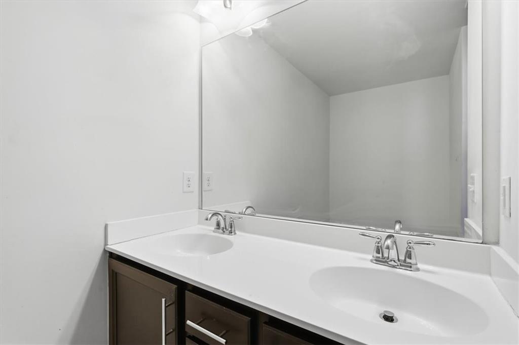 5064 Longview Walk Decatur, GA 30035 - Photo 26 of 30 a bathroom with a sink and a mirror