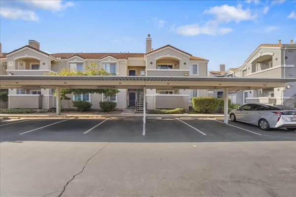 a view of a car park in front of house