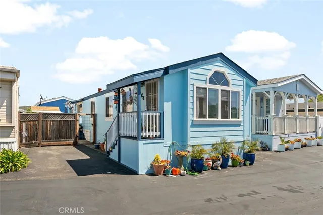 a front view of a house with many windows