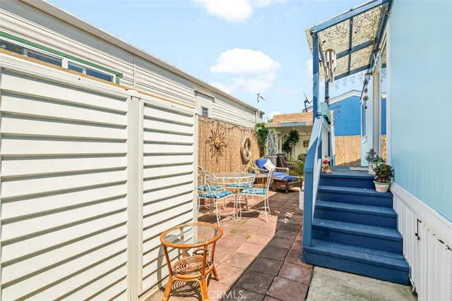 a dining room with furniture and a chandelier