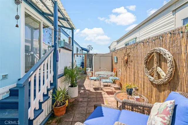 an aerial view of a kitchen with stainless steel appliances granite countertop a stove and a cabinets