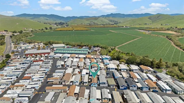 an aerial view of a city with mountains