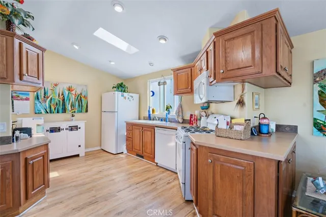 a view of a dining room with furniture and a chandelier