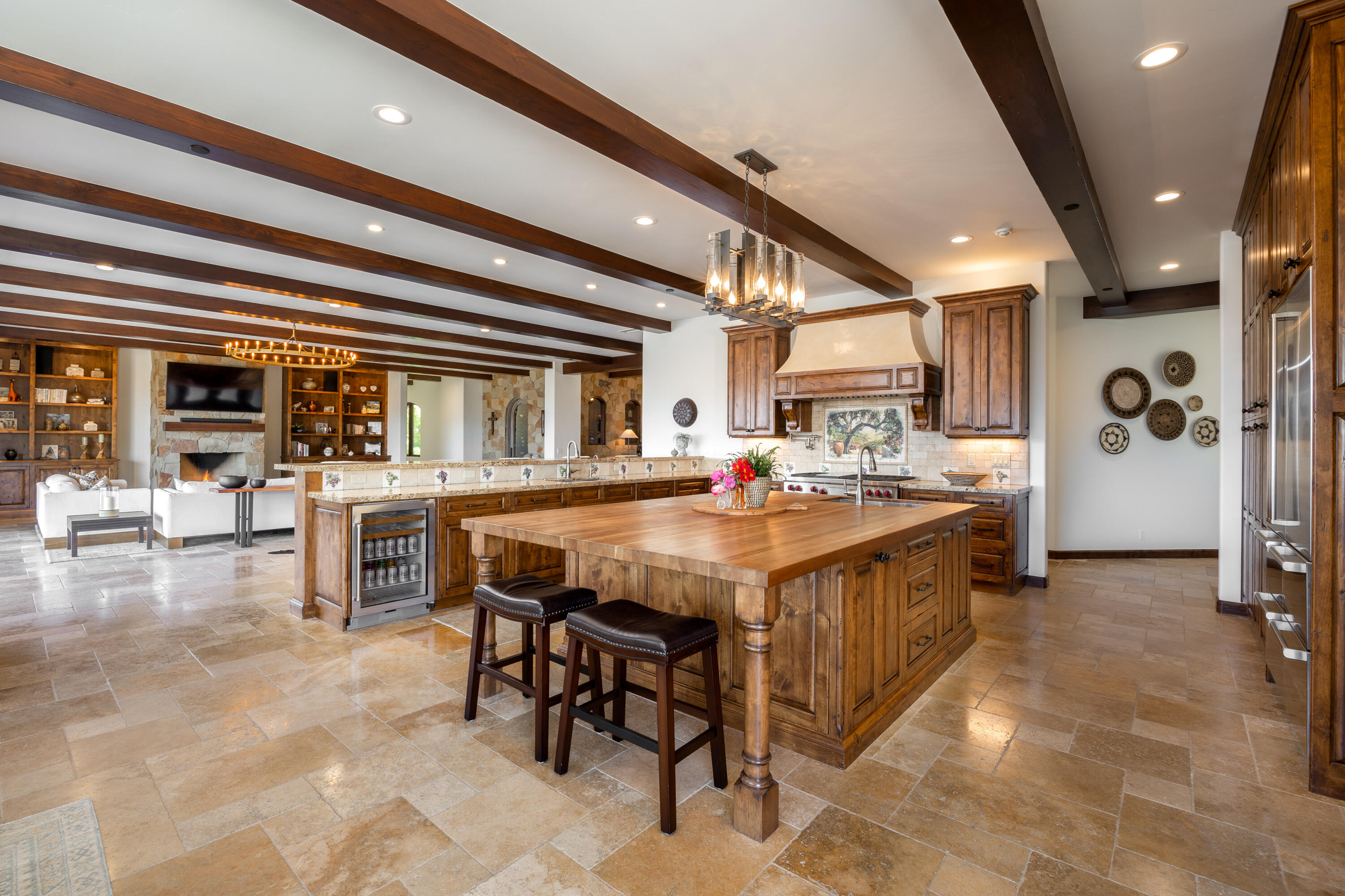 1418 Ribe Road Solvang, CA 93463 - Photo 12 of 46 a kitchen with stainless steel appliances kitchen island granite countertop a table chairs sink and cabinets